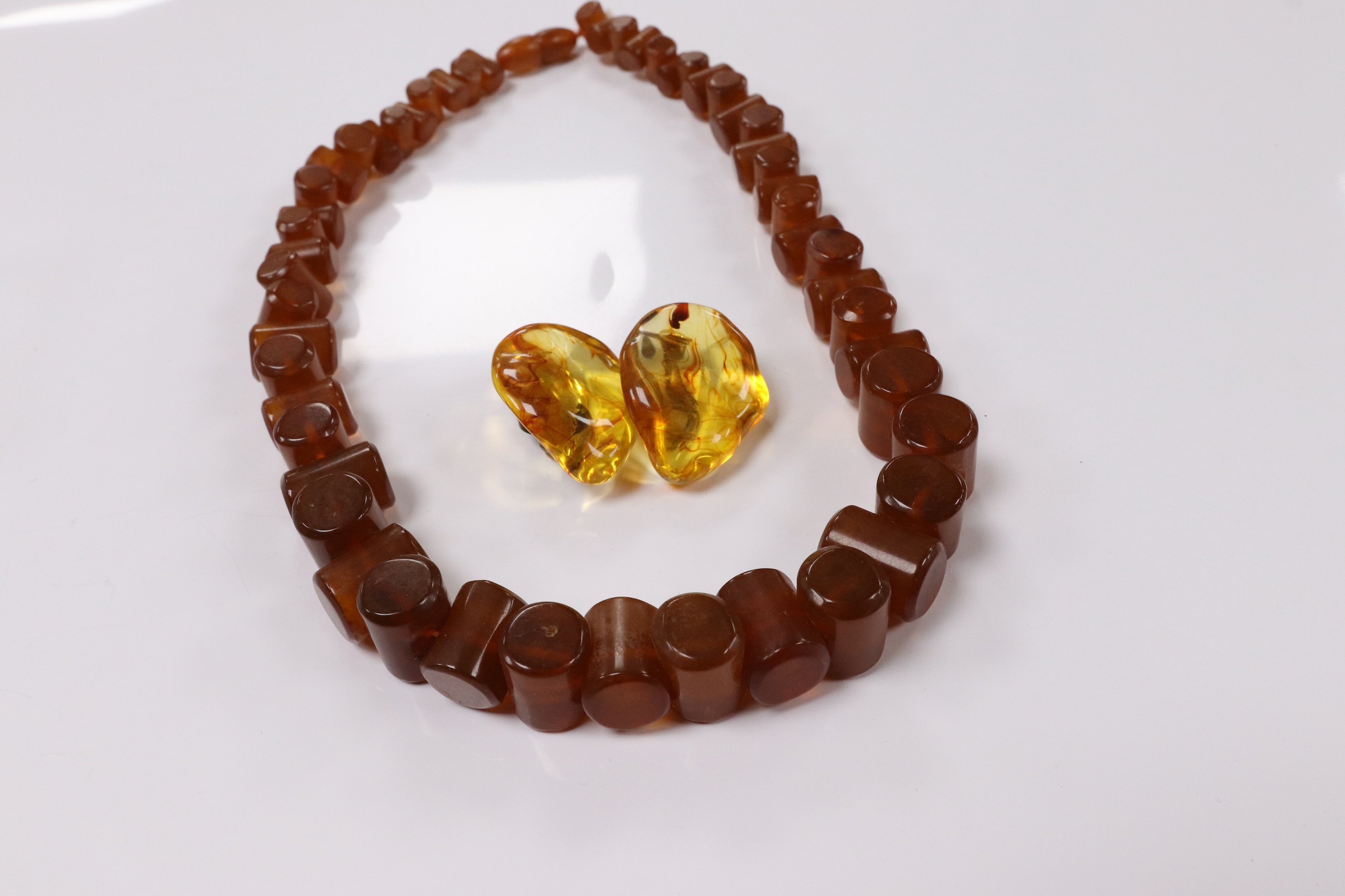 An amber necklace and a pair of earrings. Condition - fair